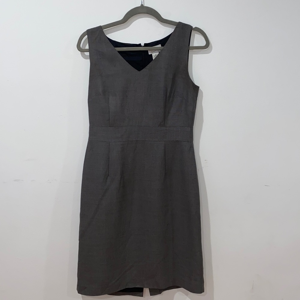 Grey armless dress with small bottom slit.